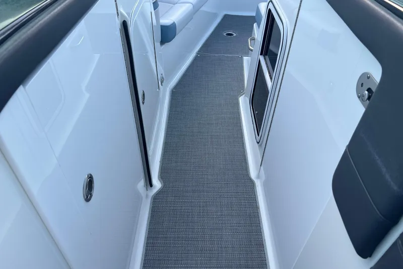 Slide: The Image of Interior walkway of a 2019 Formula 350 Crossover Bowrider I/O boat, featuring sleek design. - 40