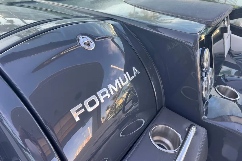 Slide: The Image of 2019 Formula 350 Crossover Bowrider I/O boat with sleek design and cup holders. - 42