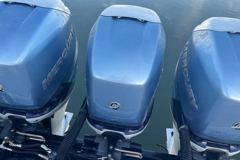 Slide: The Image of Three Mercury outboard engines on a 2019 Formula 350 Crossover Bowrider I/O boat. - 5