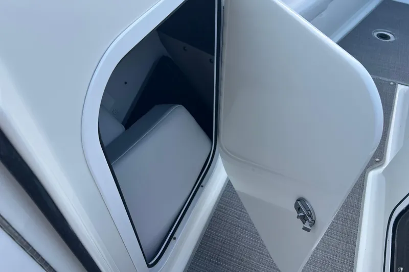 Slide: The Image of Open storage compartment on a 2019 Formula 350 Crossover Bowrider I/O boat. - 50