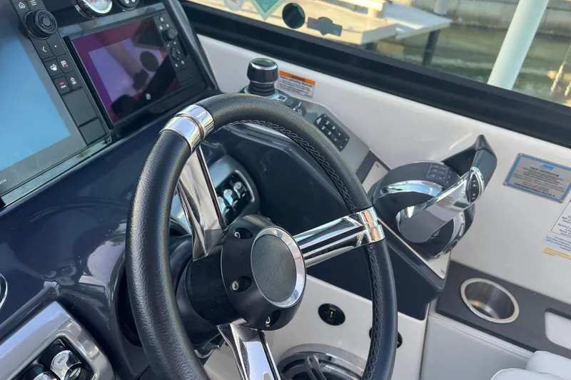 Slide: The Image of Cockpit of 2019 Formula 350 Crossover Bowrider I/O with steering wheel and controls. - 56