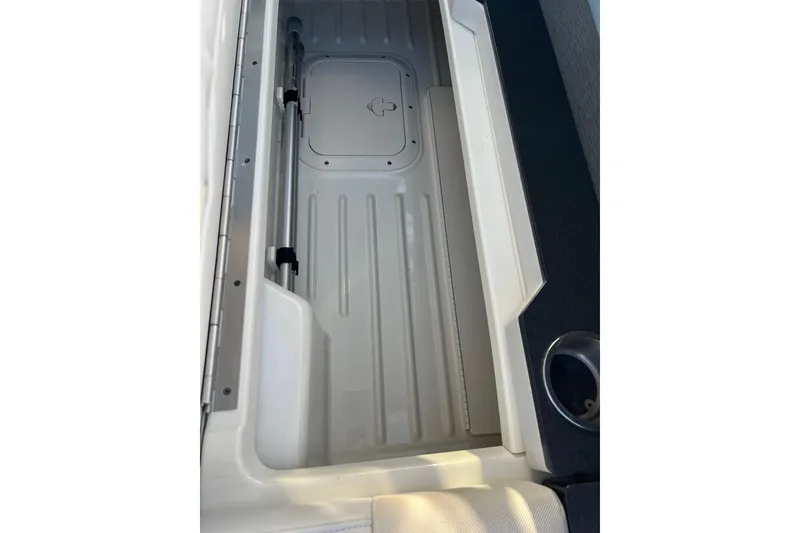 Slide: The Image of 2019 Formula 350 Crossover Bowrider I/O storage compartment with cup holder. - 58