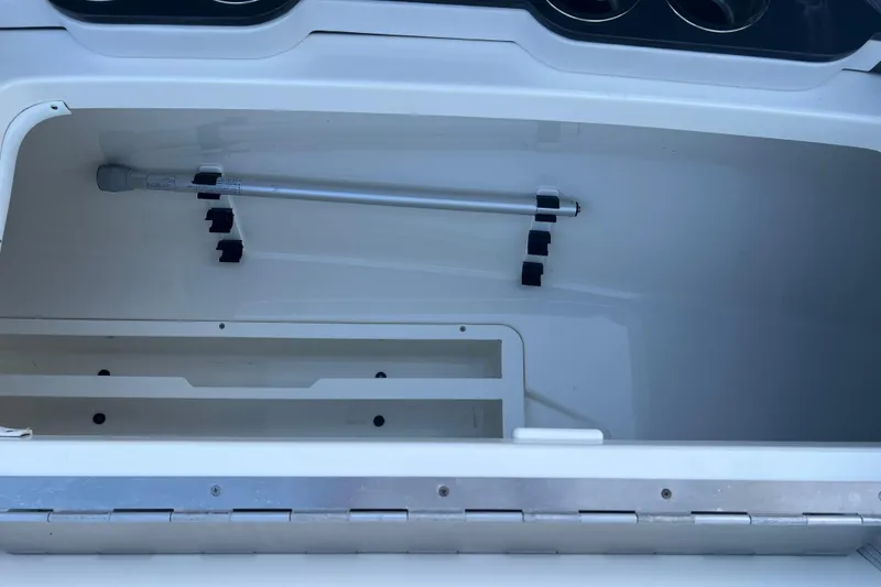 Slide: The Image of Storage compartment of 2019 Formula 350 Crossover Bowrider I/O boat, featuring organized interior space. - 59