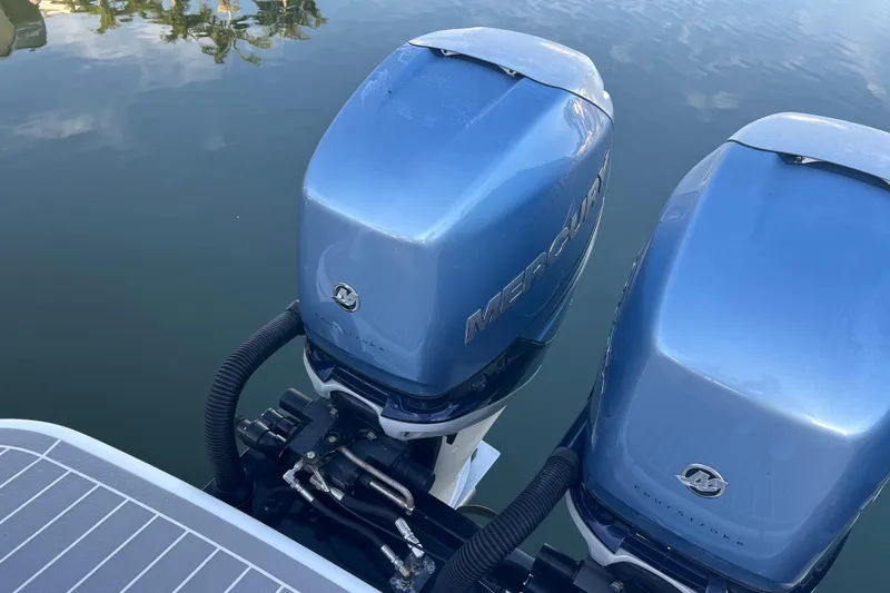 Slide: The Image of Twin Mercury outboard engines on a 2019 Formula 350 Crossover Bowrider I/O boat. - 6