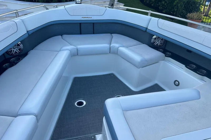 Slide: The Image of 2019 Formula 350 Crossover Bowrider I/O interior with spacious seating and cup holders. - 60