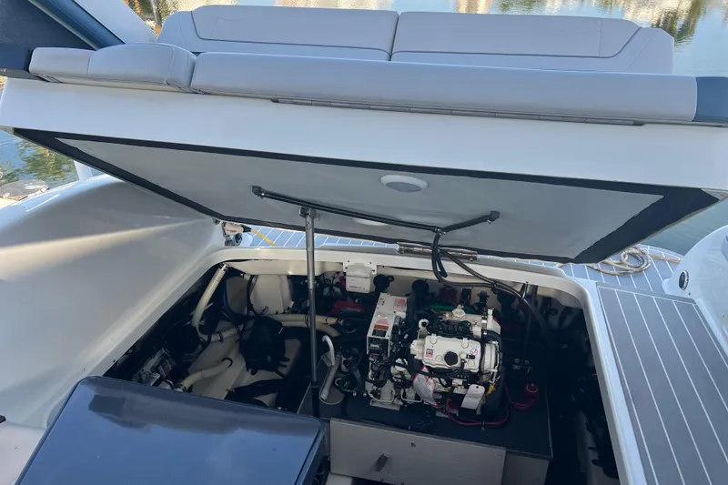 Slide: The Image of 2019 Formula 350 Crossover Bowrider I/O engine compartment with open hatch, showcasing interior components. - 62
