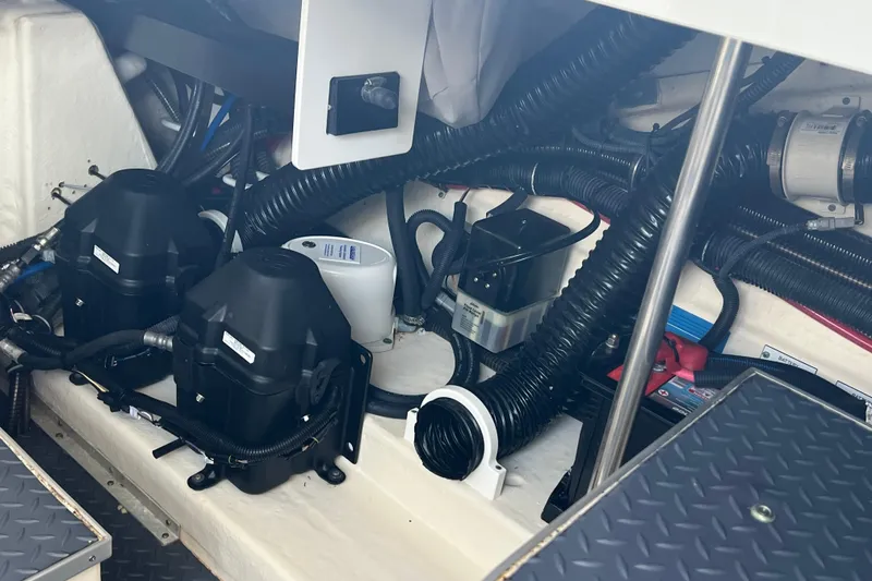 Slide: The Image of Engine compartment of a 2019 Formula 350 Crossover Bowrider I/O, showcasing mechanical components. - 63