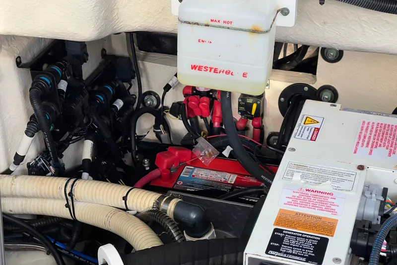 Slide: The Image of Engine compartment of a 2019 Formula 350 Crossover Bowrider I/O with wiring and components. - 64