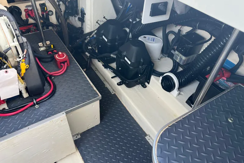 Slide: The Image of Engine compartment of a 2019 Formula 350 Crossover Bowrider I/O with wiring and components. - 67