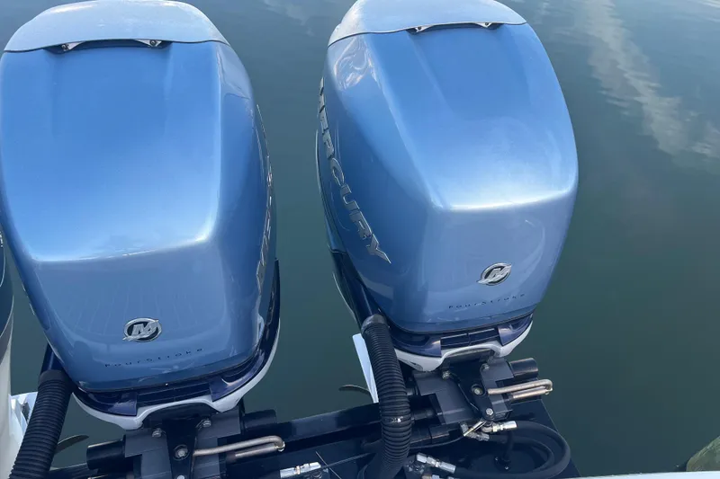 Slide: The Image of Twin Mercury outboard engines on a 2019 Formula 350 Crossover Bowrider I/O boat. - 7
