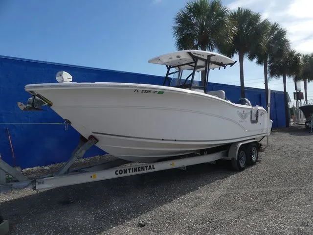 The Image of 2023 Sea Fox 268 Commander on trailer near palm trees. - 1