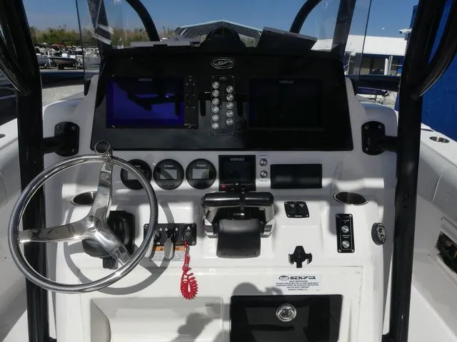 Slide: The Image of 2023 Sea Fox 268 Commander helm with modern controls and displays. - 20