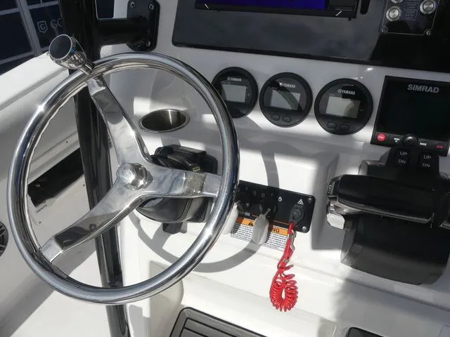 Slide: The Image of Sea Fox 268 Commander 2023 helm with steering wheel and instruments. - 28