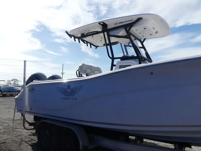Slide: The Image of 2023 Sea Fox 268 Commander boat on trailer under blue sky. - 4
