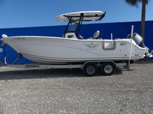 Slide: The Image of 2023 Sea Fox 268 Commander boat on trailer against blue background. - 8