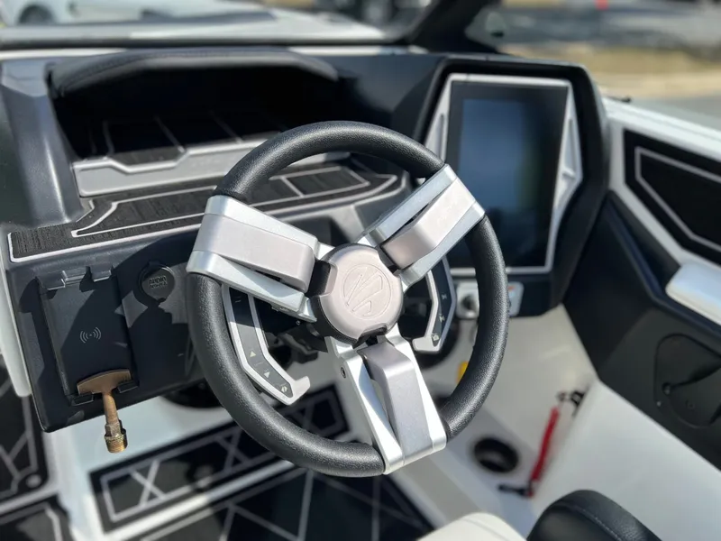 Slide: The Image of 2023 Tigé Z3 interior with modern steering wheel and display. - 20