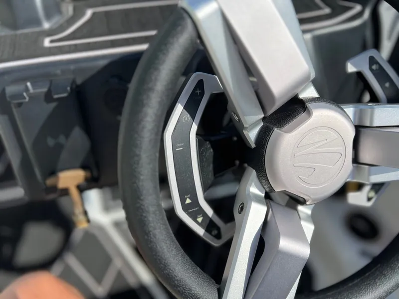 Slide: The Image of Close-up of the steering wheel in a 2023 Tigé Z3 boat. - 22