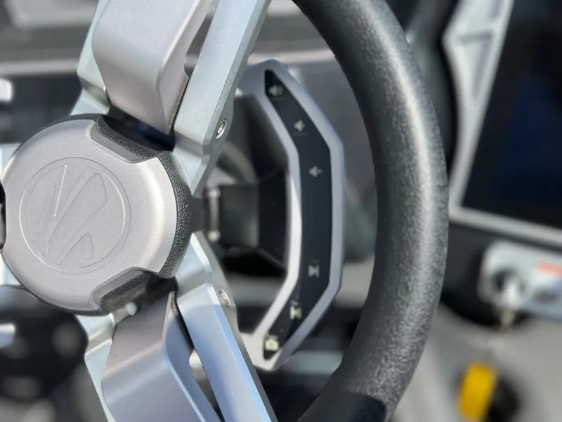 Slide: The Image of Close-up of the steering wheel in a 2023 Tigé Z3 boat. - 23