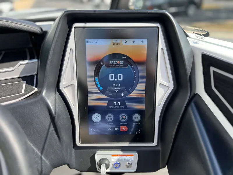 Slide: The Image of 2023 Tigé Z3 boat display with speedometer and controls. - 25