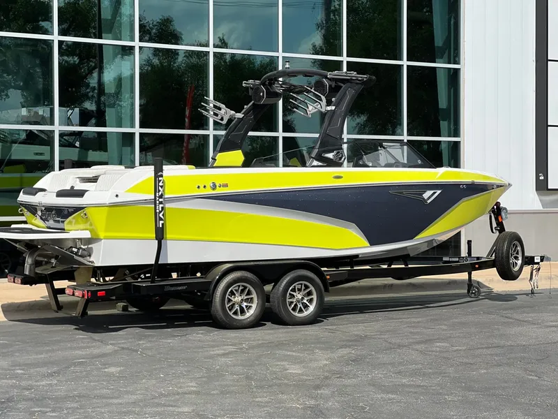 Slide: The Image of 2023 Tigé Z3 boat on trailer in front of glass building. - 3