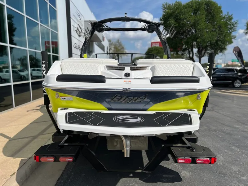 Slide: The Image of Rear view of a 2023 Tigé Z3 boat in a parking lot. - 4