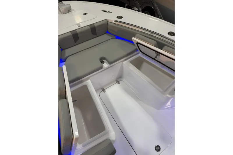 Slide: The Image of Interior view of 2026 Cape Horn 28 XS boat with seating and storage compartments. - 13