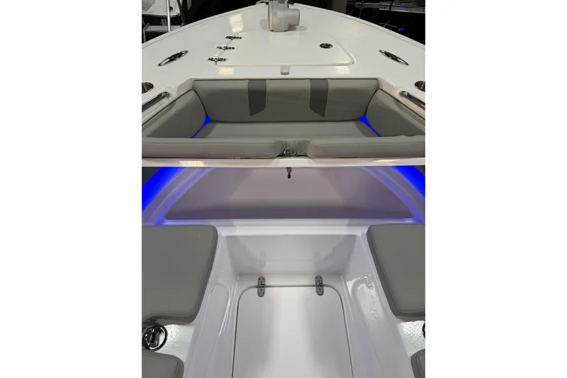 Slide: The Image of 2026 Cape Horn 28 XS boat interior with cushioned seating and blue LED lighting. - 14