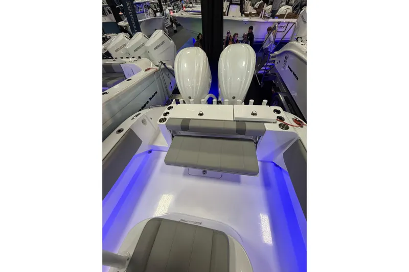 Slide: The Image of 2026 Cape Horn 28 XS boat interior with dual engines and illuminated deck. - 7