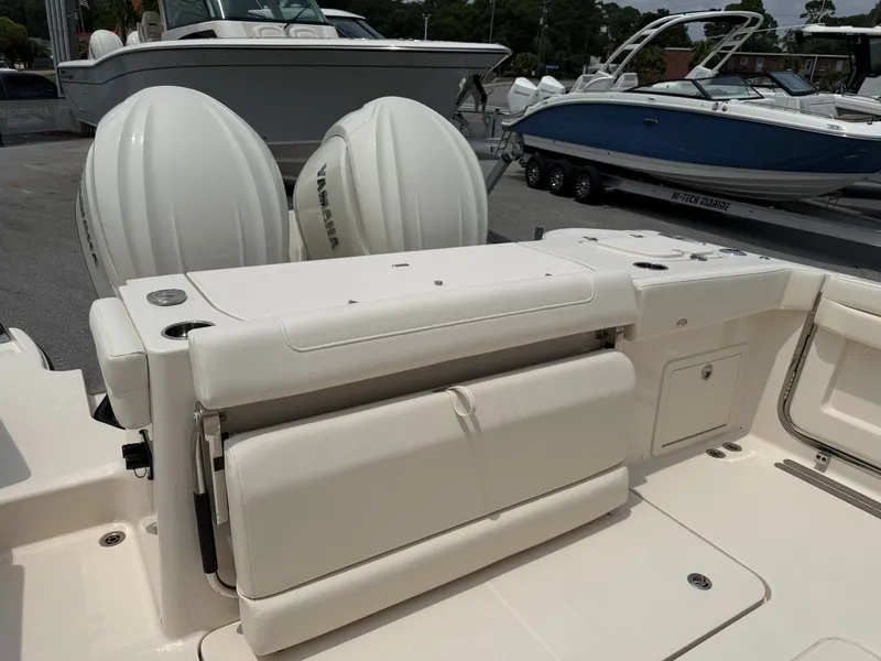 Slide: The Image of The image shows the stern of a Grady-White Canyon 326 boat with two large outboard engines. - 17