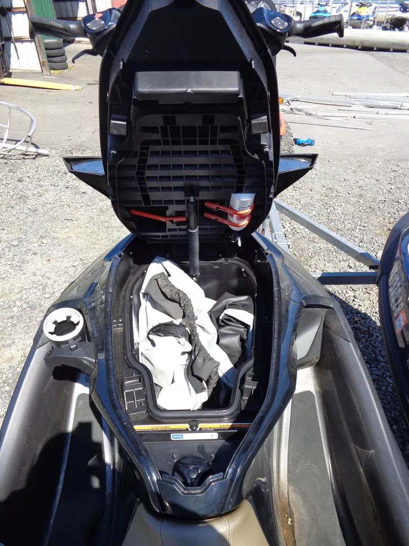 Slide: The Image of Open storage compartment of 2023 Sea-Doo GTX 170 IBR jet ski. - 14