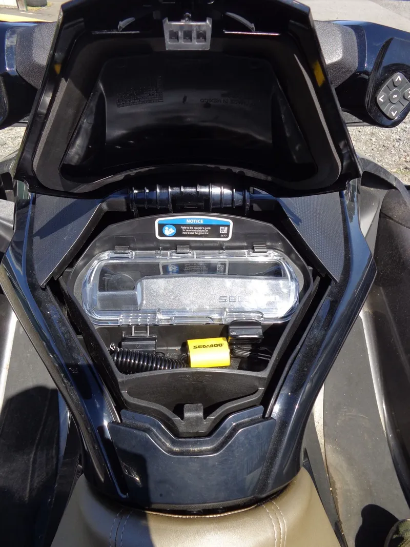 Slide: The Image of 2023 Sea-Doo GTX 170 IBR storage compartment with accessories. - 17