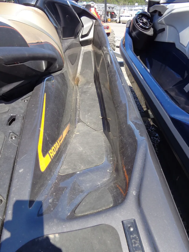 Slide: The Image of 2023 Sea-Doo GTX 170 IBR jet ski, side view, black and yellow. - 5