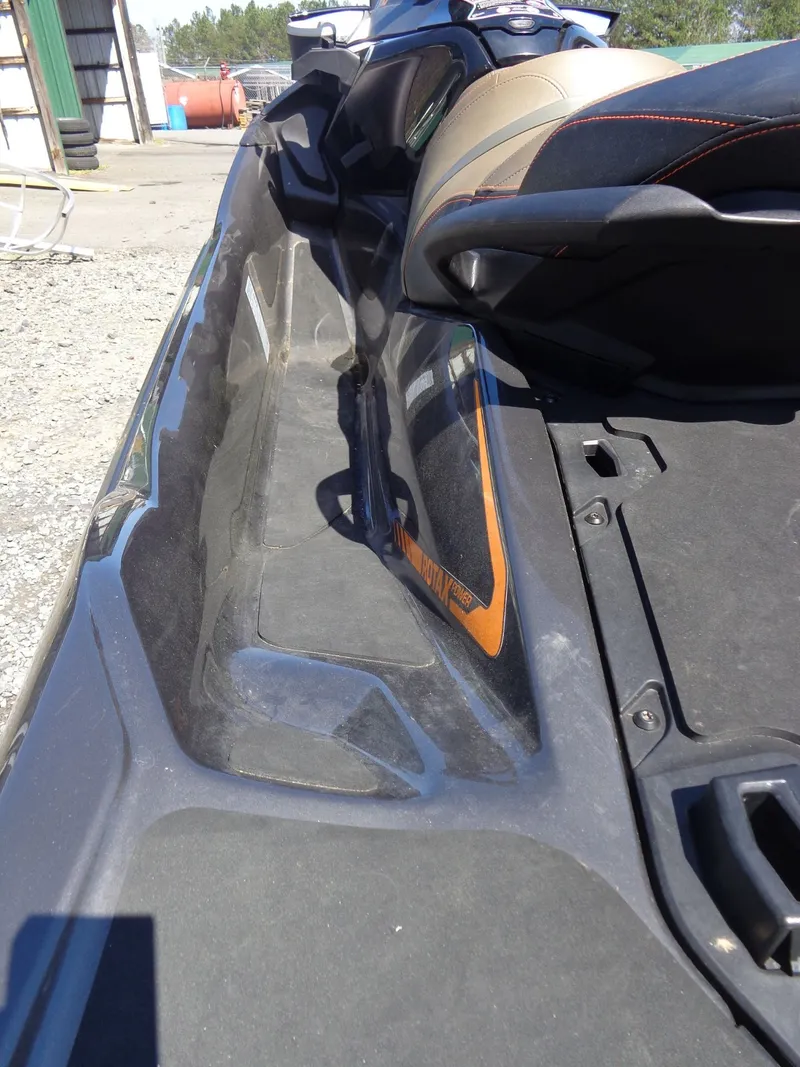 Slide: The Image of Close-up of a 2023 Sea-Doo GTX 170 IBR jet ski on a parking lot. - 6