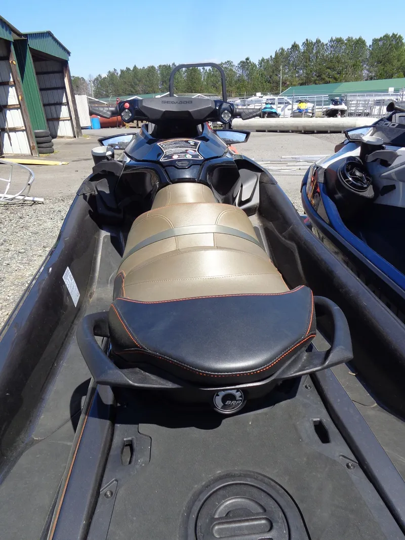 Slide: The Image of 2023 Sea-Doo GTX 170 IBR jet ski parked outdoors. - 7