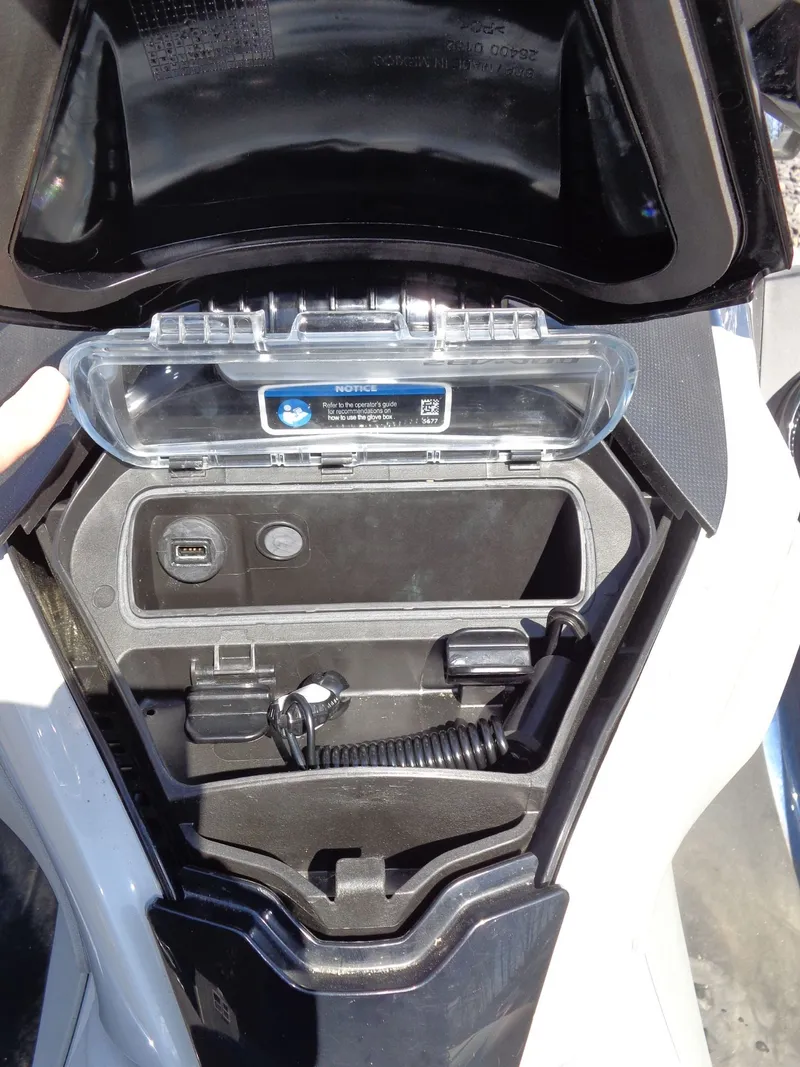 Slide: The Image of 2023 Sea-Doo GTX Limited 300 iDF storage compartment with USB port. - 14