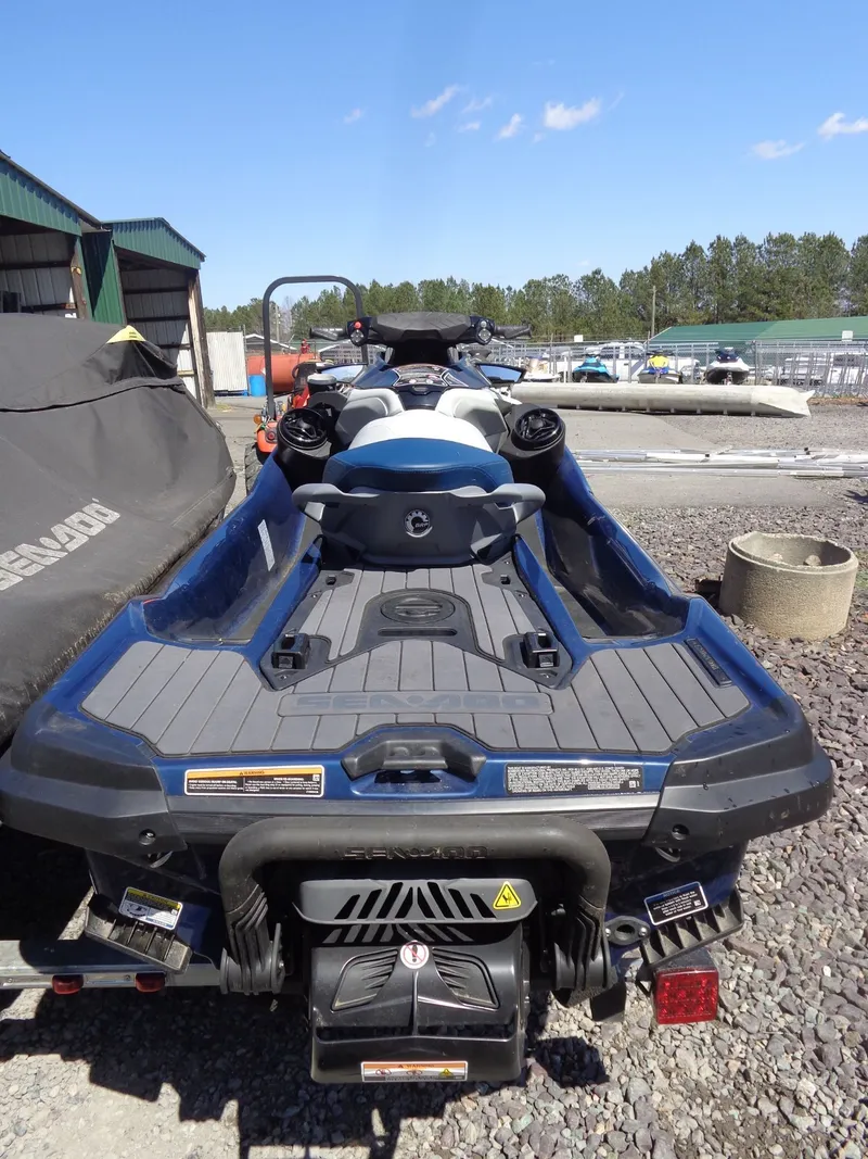 Slide: The Image of 2023 Sea-Doo GTX Limited 300 iDF parked on gravel lot. - 4