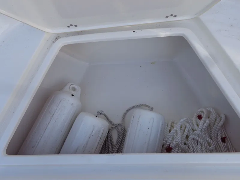 Slide: The Image of Storage compartment in Key West 189 FS boat with fenders and ropes. - 38