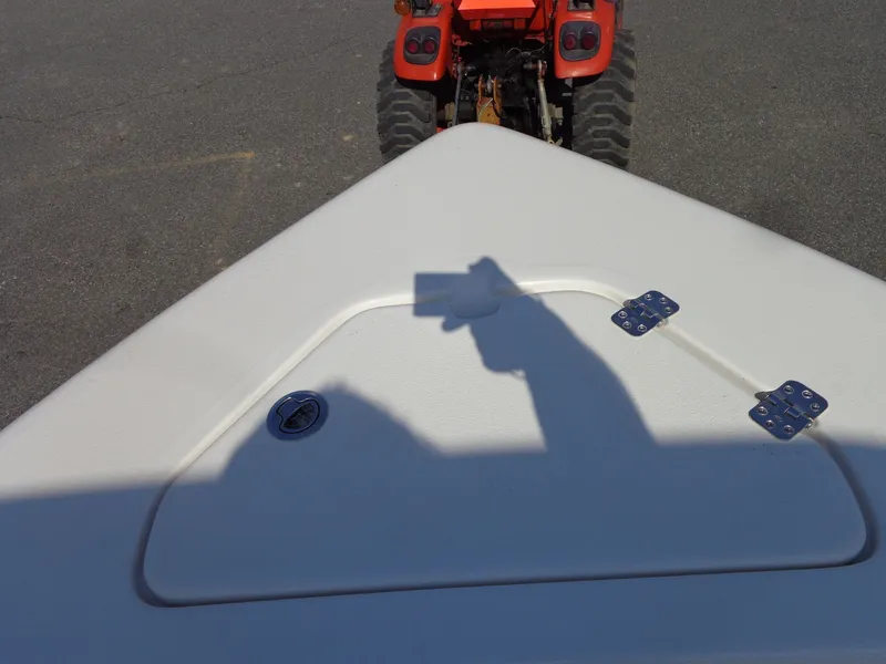 Slide: The Image of Bow of a 2023 Key West 189 FS boat with tractor in background. - 39