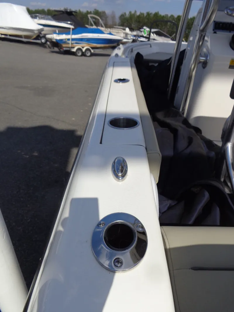 Slide: The Image of Key West 189 FS 2023 boat with cup holders and seating area. - 5