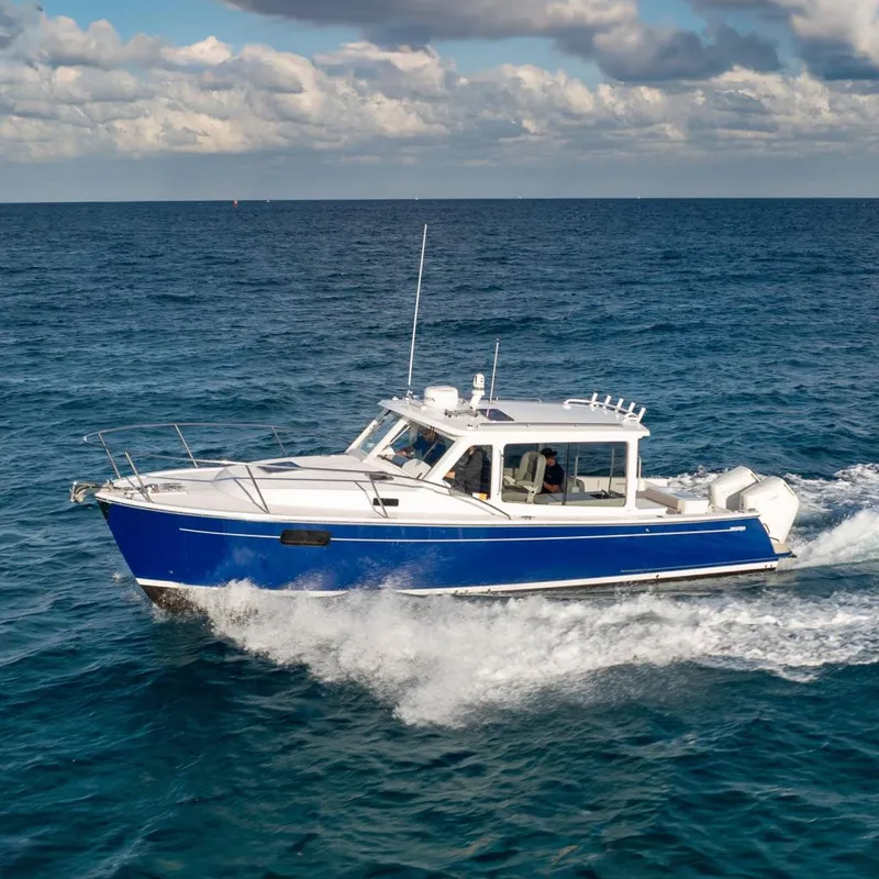 The Image of 2026 MJM 38RS boat cruising on open sea under cloudy sky. - 0