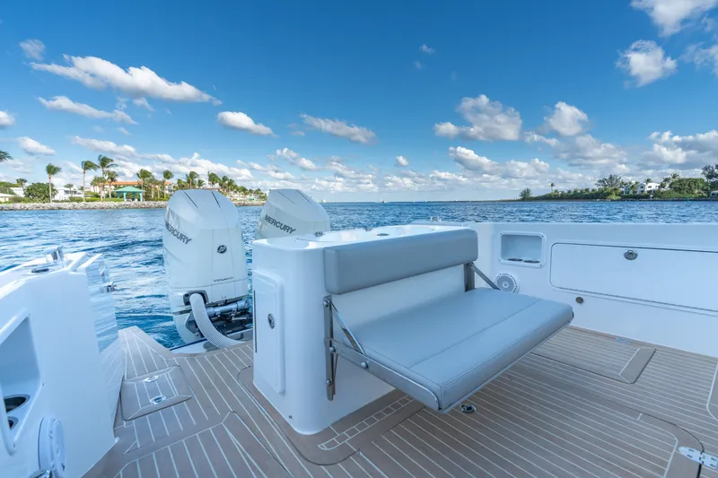 Slide: The Image of 2026 MJM 38RS boat with Mercury engines on a sunny day. - 11
