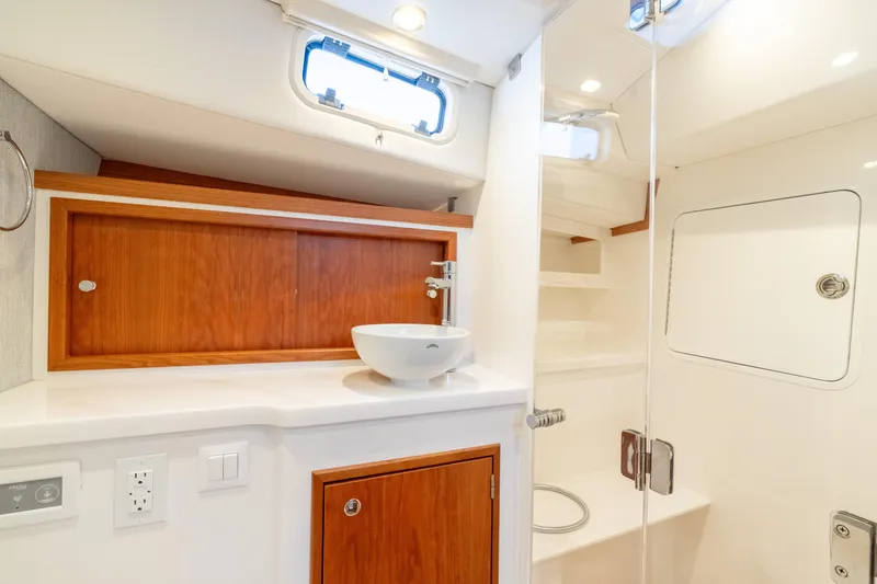 Slide: The Image of Modern bathroom interior of 2026 MJM 38RS yacht with sleek design and wooden accents. - 15