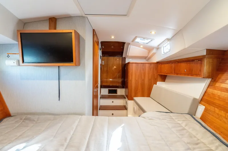Slide: The Image of Luxurious interior of 2026 MJM 38RS yacht with wood finishes and modern amenities. - 16