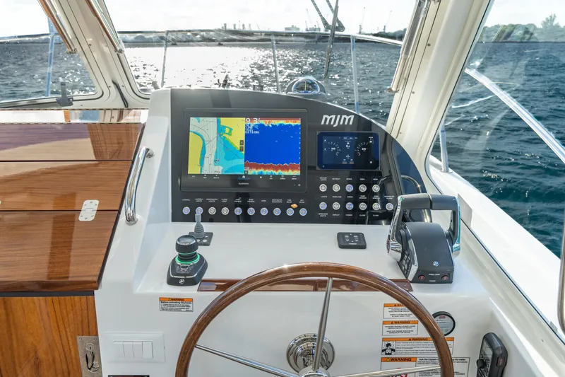 Slide: The Image of Helm of 2026 MJM 38RS yacht with navigation display and controls. - 3