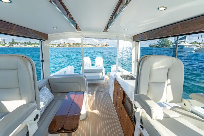 Slide: The Image of Luxurious 2026 MJM 38RS yacht interior with elegant seating and ocean view. - 6
