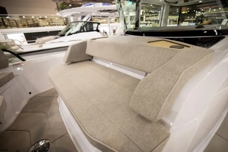 Slide: The Image of 2027 Axopar 29 XC Cross Cabin interior seating with beige upholstery, showcasing modern design. - 4