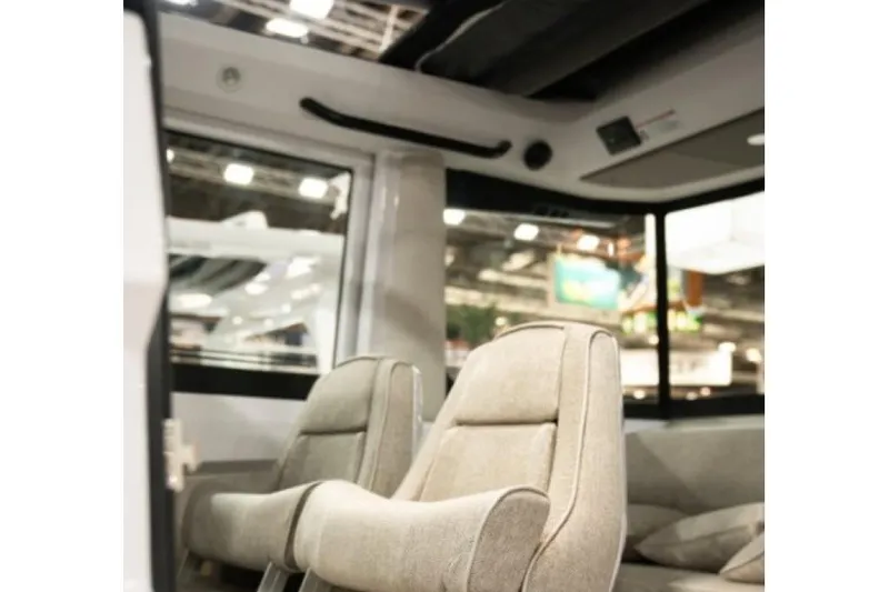 Slide: The Image of Interior of 2027 Axopar 29 XC Cross Cabin, featuring modern seating and sleek design. - 5