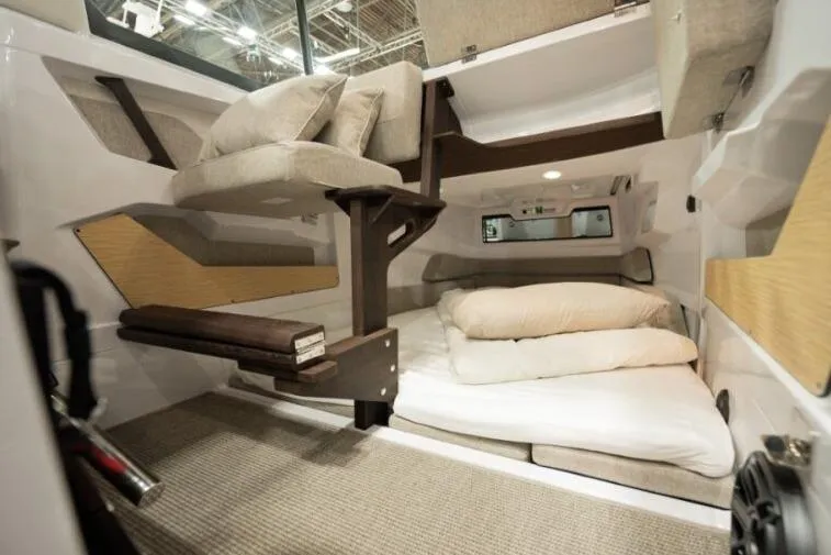 Slide: The Image of Interior of 2027 Axopar 29 XC Cross Cabin with cozy sleeping area and modern design. - 9