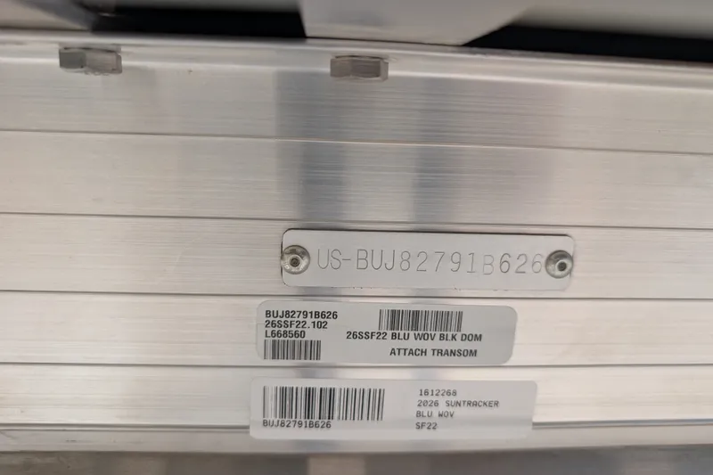 Slide: The Image of 2026 Sun Tracker SportFish 22 DLX identification plate with serial numbers and model details. - 93