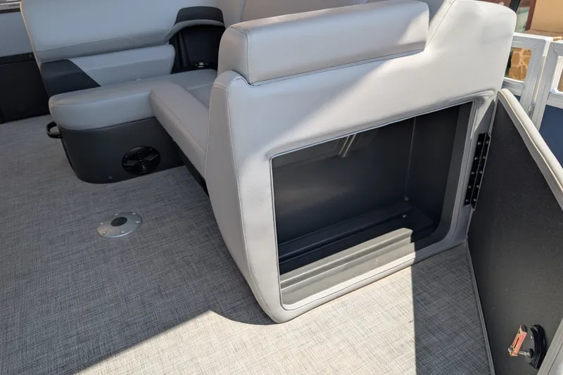 Slide: The Image of 2026 Sun Tracker SportFish 22 DLX boat interior with open storage compartment. - 12